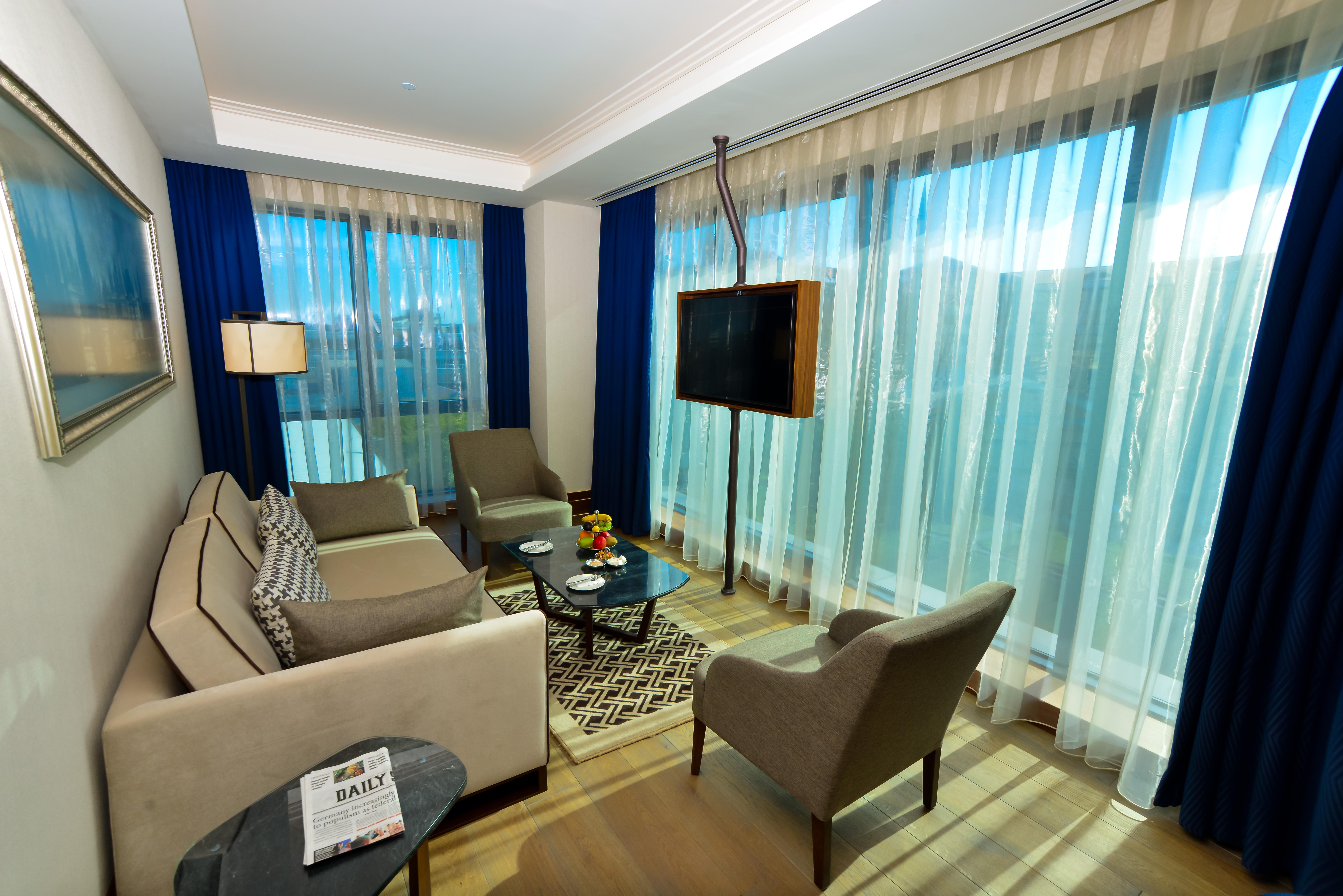 Отель Golden Tulip Istanbul Bayrampasa Экстерьер фото Living room
